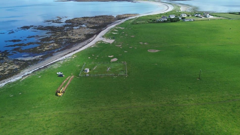 Aerial view of the Fenit coastline with investigation trenches on the grassland